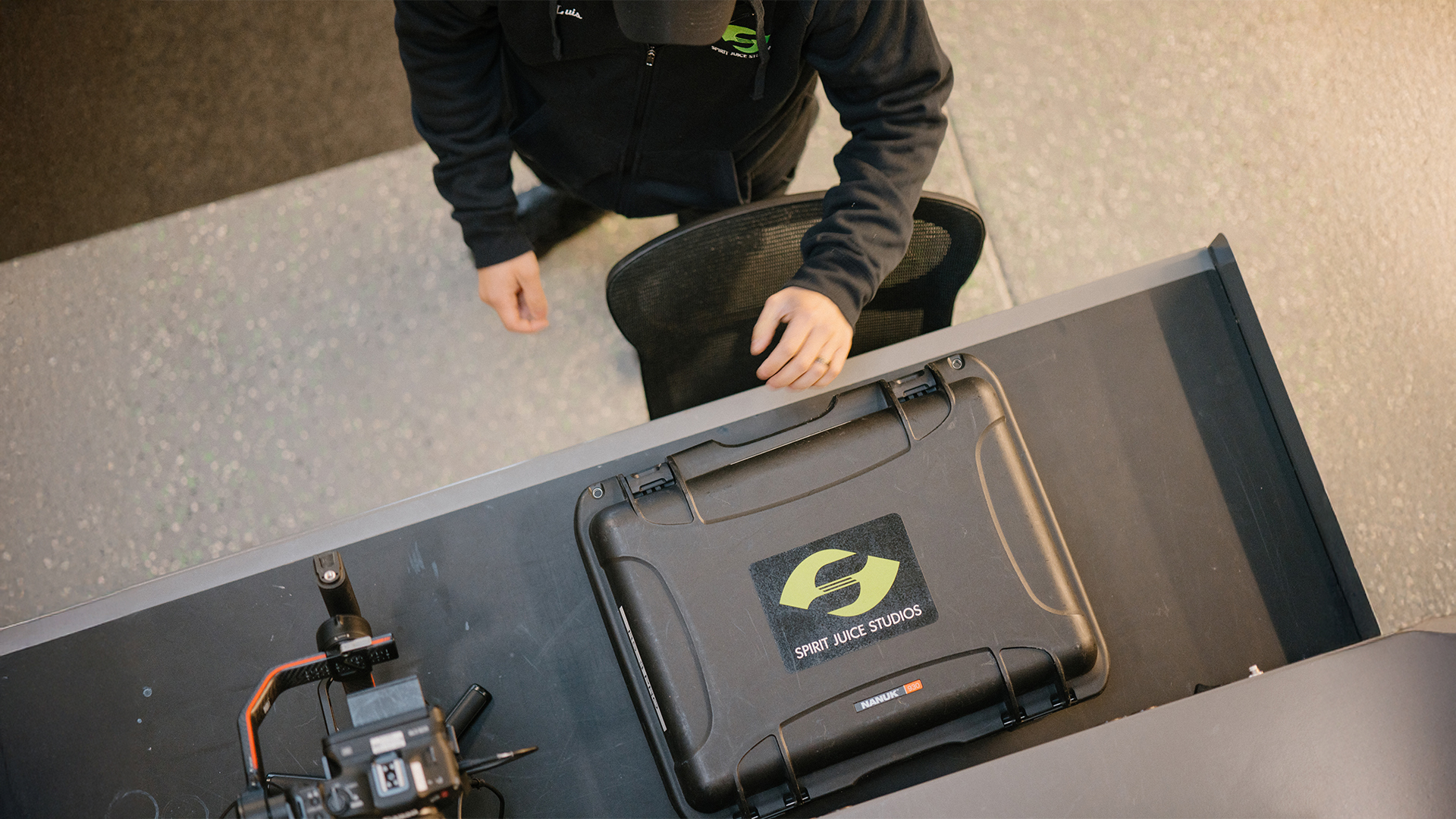A church media team member prepares a professional gear case and camera equipment on a table, representing the best video kit for church video production and ministry content creation.